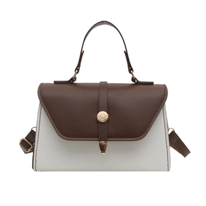 Sac à main bicolore moderne marron et blanc avec boucle dorée ronde et poignée haute