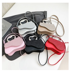 Top view of mini square crossbody bags with sparkling lids and heart shaped handles