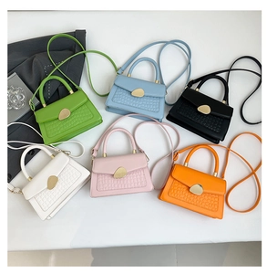 Detailed overhead view of six colorful crocodile pattern PU leather crossbody bags with gold buckles