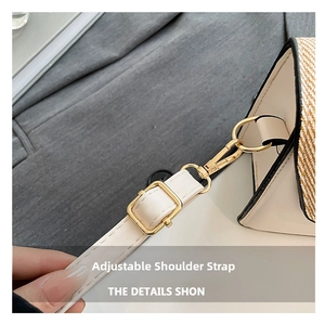 Detail of adjustable leather strap with gold buckle on contrast stitch crossbody bag