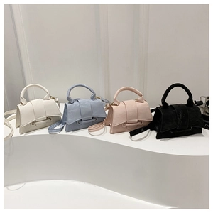 Detailed set of mini leather crossbody bags in four pastel colors with unique ring detail