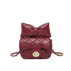 Elegant wine red quilted crossbody bag with bow decoration and gold chain strap