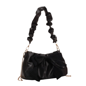 Chic black shoulder bag with a large bow detail and ruched strap with gold chains