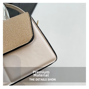 Detailed close-up of contrasting woven fabric and smooth cream leather on a handbag