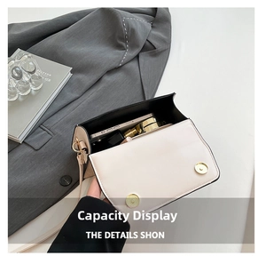 Interior view showing capacity of off-white crossbody bag with gold magnetic buckle