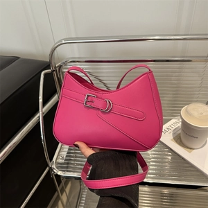 Chic rose red underarm bag with decorative buckle and adjustable shoulder strap