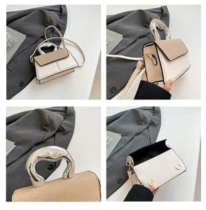 Detail of cream crossbody bag showing silver sculptural handle and woven flap texture