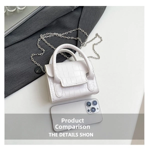 Mini white stone-embossed handbag compared to a smartphone to show compact size