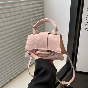 Pink minimalist crossbody handbag with marbled patent leather and top handle