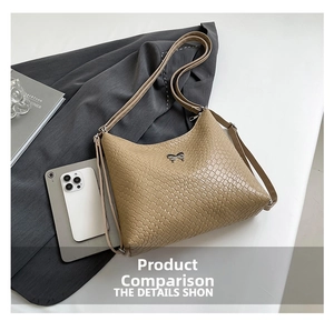 Detail of beige woven texture shoulder bag with a decorative silver bow metal buckle