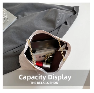 Interior view showing the large capacity of the woven tote bag with daily essentials