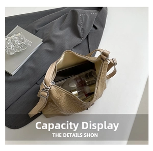 Spacious interior of camel woven tote bag showing daily essentials for capacity display
