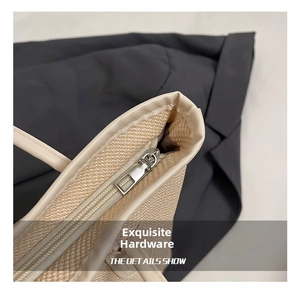 Close-up of high-quality silver metal zipper and woven texture on this tote bag