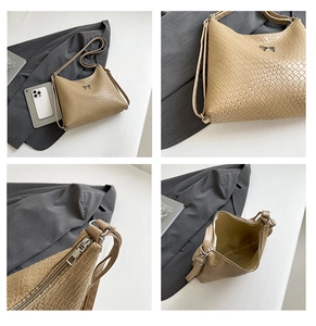 Detail view of woven texture tote bag featuring metallic bow and spacious interior