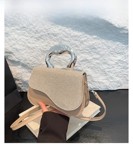 Detail of khaki square crossbody bag with rhinestone flap and silver metallic handle