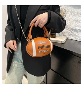 Detail view of American football shaped bag with contrast lettering and gold chain strap