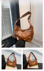 Close-up of brown PU leather shoulder bag featuring silver metal spherical stud details