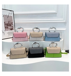 Detail shot of mini crossbody bags in six colors with unique silver metal handles