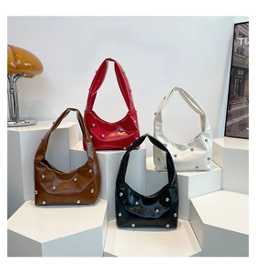 Detailed display of four retro rivet shoulder bags in brown, red, black, and beige colors