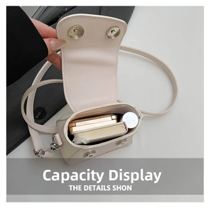 Interior view of cream crossbody bag showing capacity for cosmetics and notebook