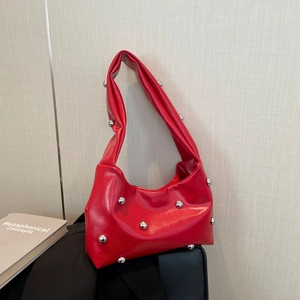 Chic red patent leather underarm bag with silver stud embellishments for a trendy look