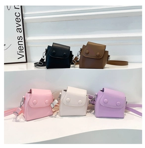 Mini flap crossbody bags in five colors displayed on white steps with thin straps