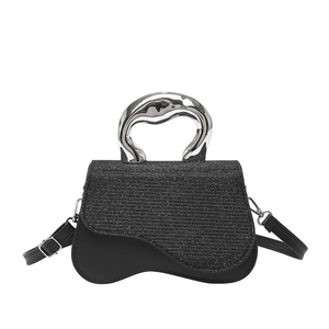 Luxury black rhinestone handbag with silver fluid handle and curved base crossbody design