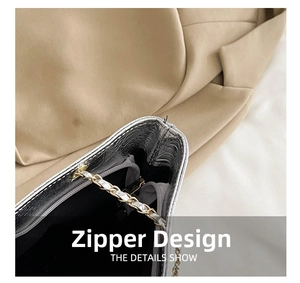 Detail view of the silver crocodile pattern bag interior featuring a secure zipper pocket