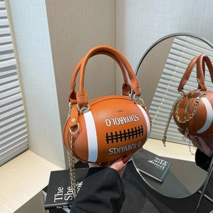 Fashionable rugby-shaped brown leather handbag with chain strap and white sports stripes