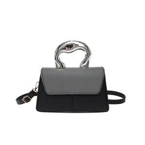 Modern color-block handbag with metallic fluid handle and adjustable shoulder strap