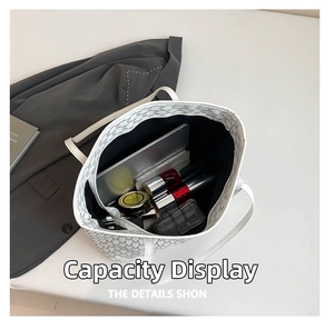 Interior view showing the large capacity of a white tote bag with grey M-pattern