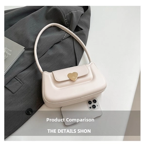 Detail view of cream PU shoulder bag with heart-shaped gold buckle and size comparison