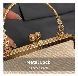 Macro detail of golden sunflower hardware and metal clasp on cream woven handbag