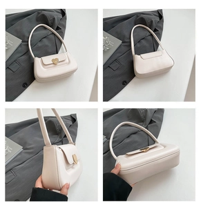 Detailed four-way view of off-white faux leather shoulder bag with gold heart clasp
