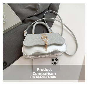 Detail view of silver wavy handbag with golden S logo tassel and size comparison
