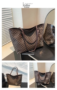 Detail of coffee tote bag featuring all-over M print and metallic M charm