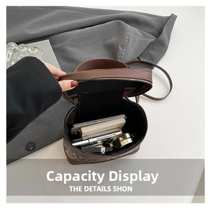 Detailed interior capacity showing leopard print bucket bag with phone and cosmetics