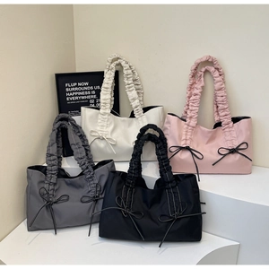 Four large pleated nylon tote bags with bow details in white, pink, grey and black
