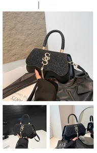 Detail of black crossbody bag with sequin texture, wavy edge, and gold S-logo