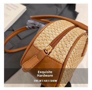 Close-up of golden metal zipper and straw woven texture on a stylish handbag