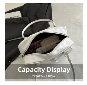 Top view showing large capacity of the white tote bag with phone and wallet inside