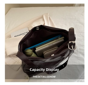 Top view of deep brown faux leather tote bag showing large capacity for tablet and books