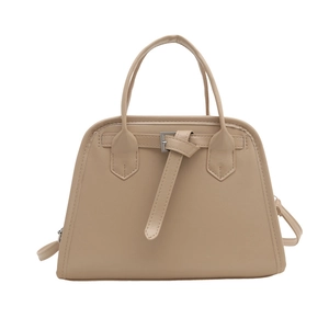 Chic beige trapezoid tote bag with metal buckle strap for modern women's fashion