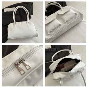 Detail view of white PU leather bag showing multi-pockets and spacious inner storage