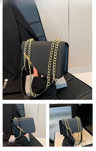 Detail of black crossbody bag with diagonal woven texture and gold chain strap