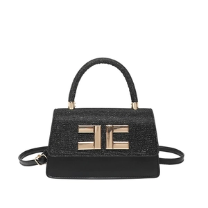 Chic black handbag with gold buckle and textured flap shown from front on white background