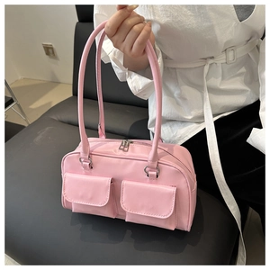 Pink underarm bag with double front flap pockets and silver hardware details