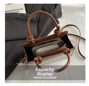 Detail view of the spacious interior showing capacity for a wallet and smartphone