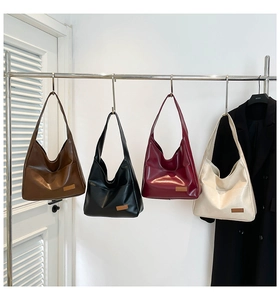 Detailed display of four vintage large capacity tote bags in dark brown, black, burgundy, and beige