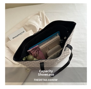 Spacious interior of beige monogram tote bag showing daily essentials and dark lining